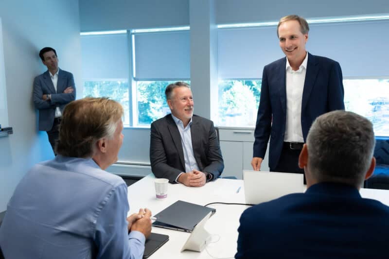 Five men in a meeting room at Balchem Careers.